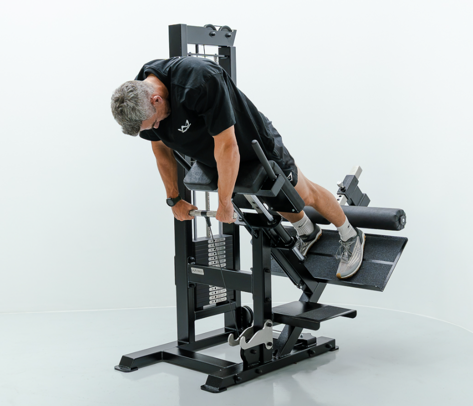 Athlete using a seated back extension machine